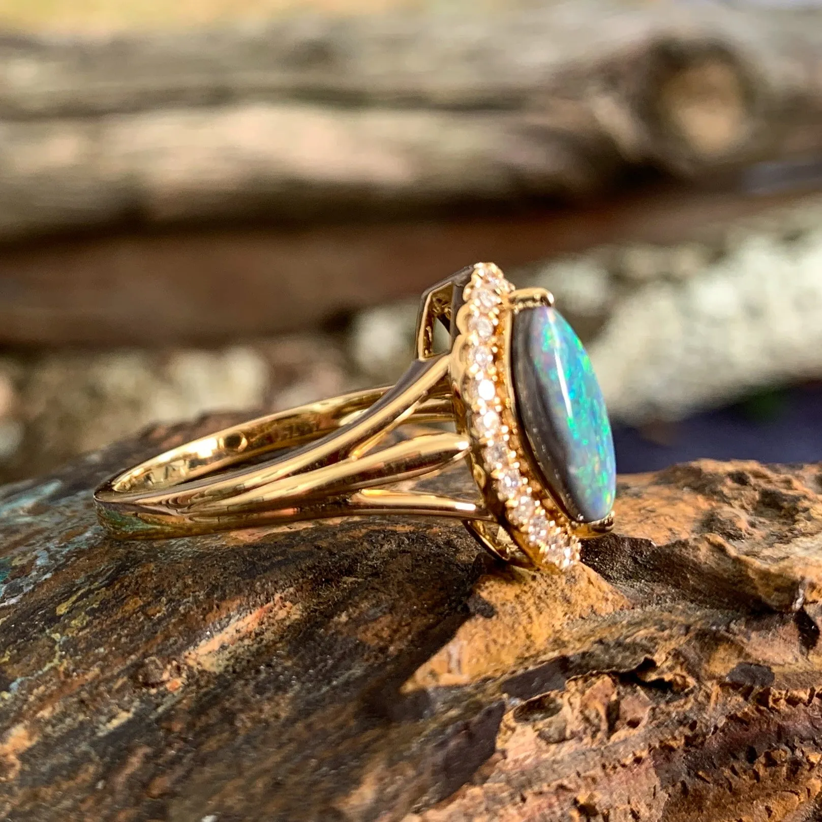 18kt Yellow Gold marquise shape cluster and Black Opal ring