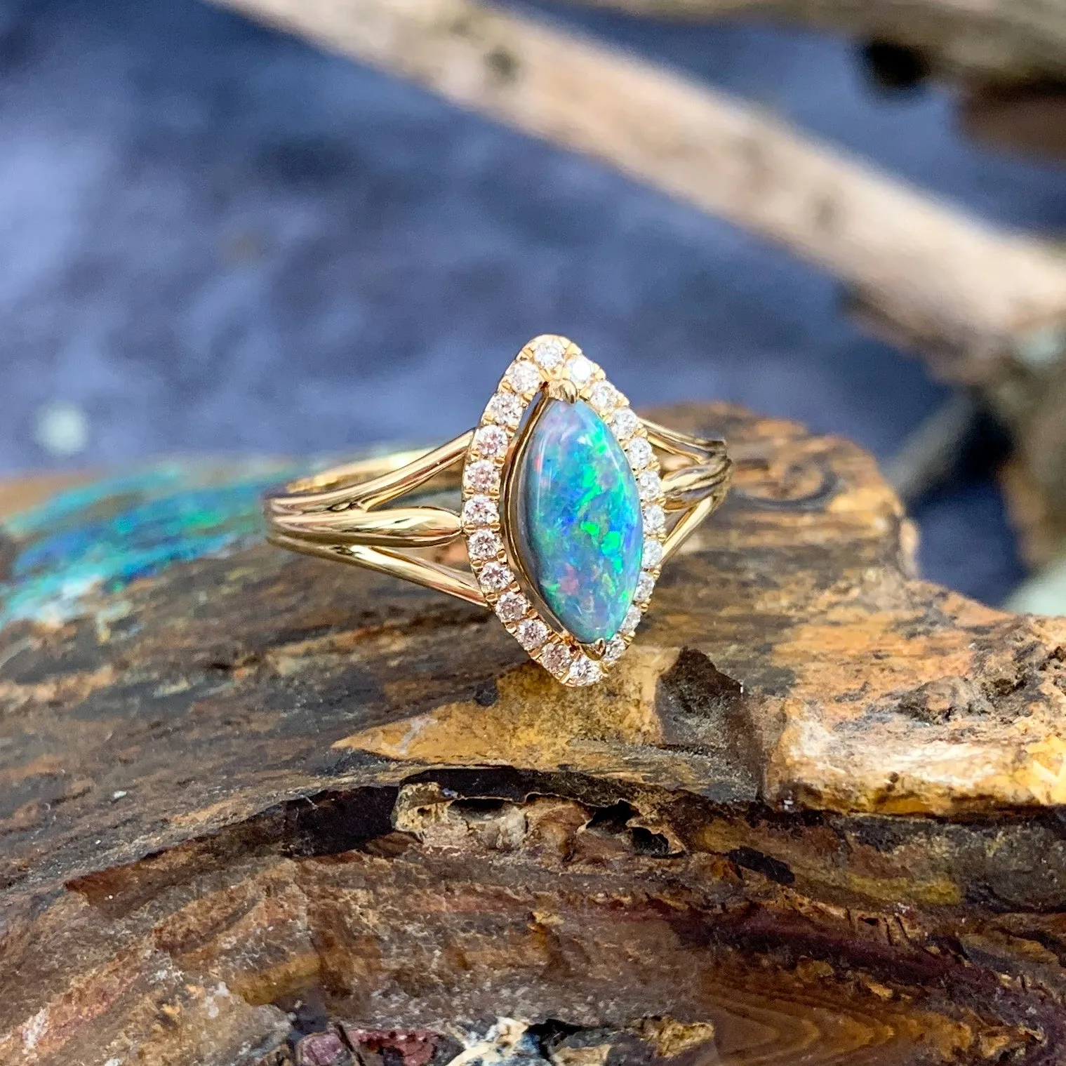 18kt Yellow Gold marquise shape cluster and Black Opal ring