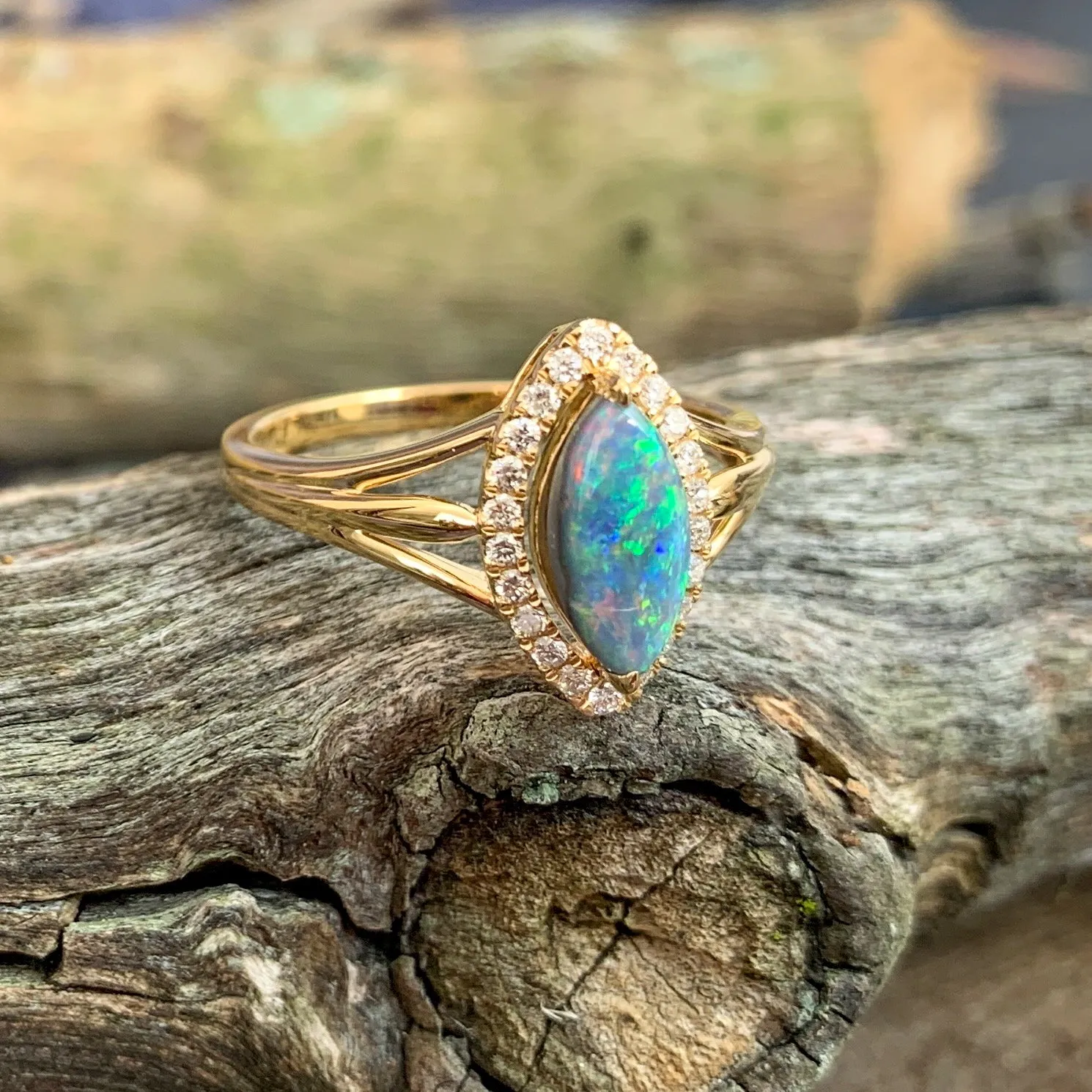 18kt Yellow Gold marquise shape cluster and Black Opal ring